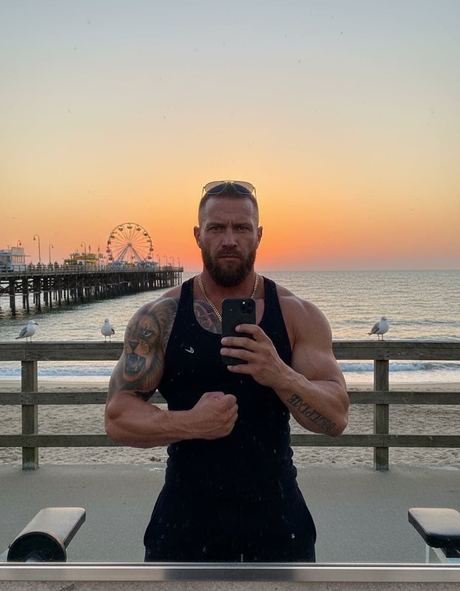 gym mirror selfie in a tank top, flexing, intense stare, Brent Kowalski
